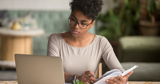 Woman conducting research on a computer - Overcoming stigma around adult incontinence